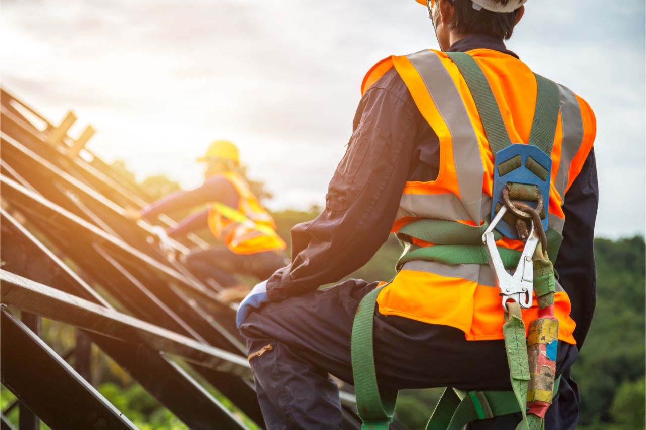 Close up photo of man wearing harness