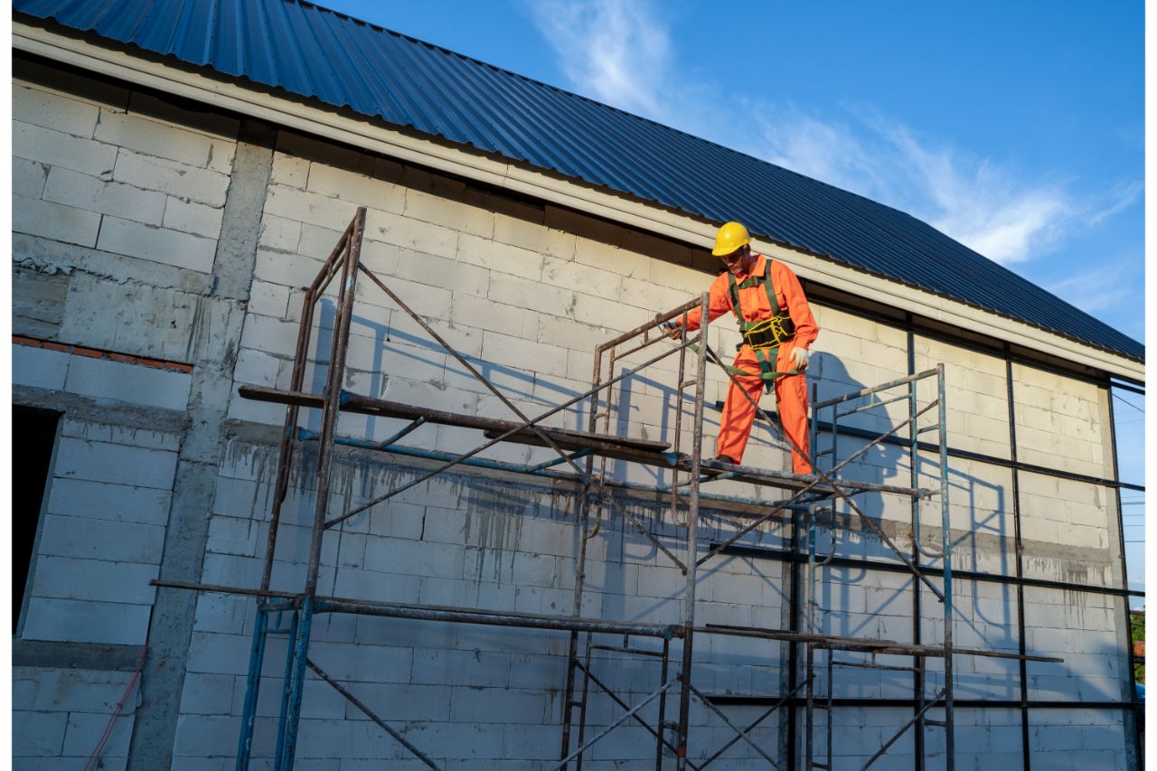 Working installing new roof at construction site